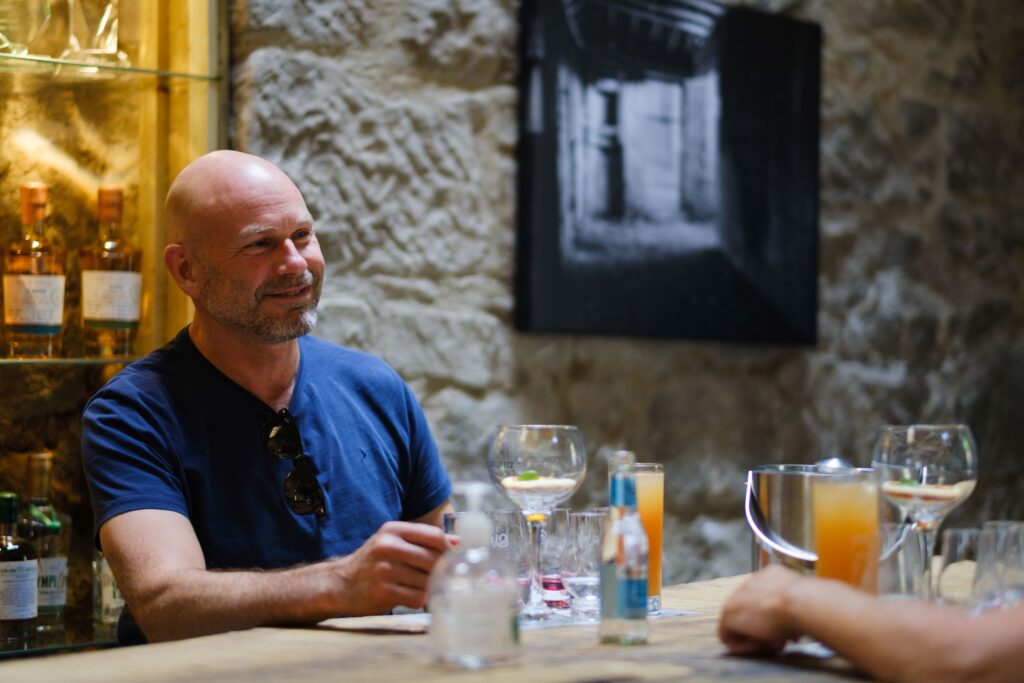 Man enjoying a gin in the distillery bar