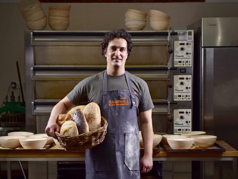 Zsolt holding basket of bread