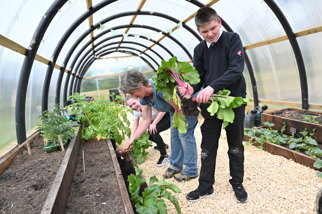 School children from Braes High in Polmont who have worked with the Forth Environment Link on their Young Good Food Ambassadors project. The project included funding for a poly tunnel which has enabled kids to grow a substantial amount of fresh produce