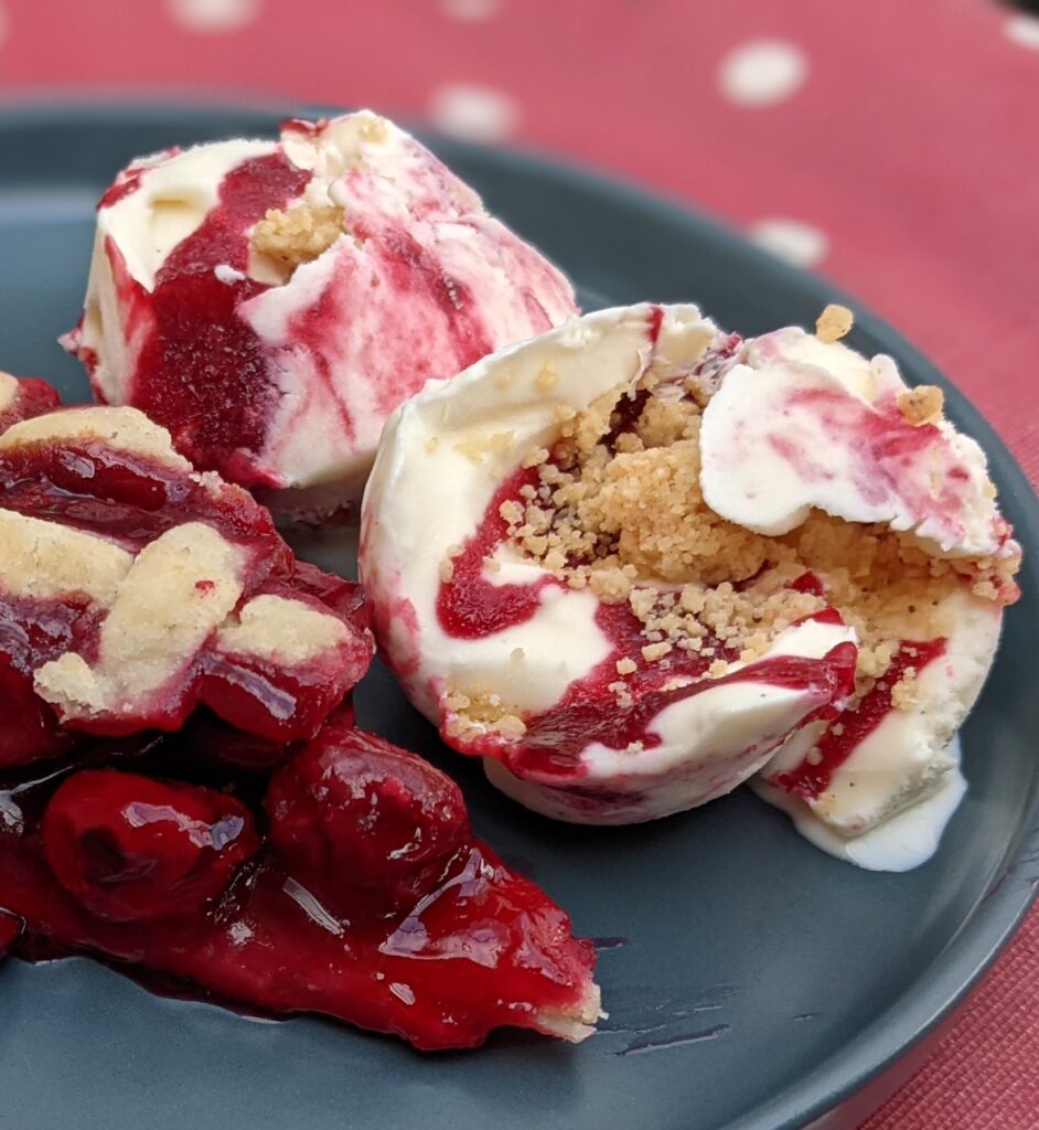 Cherry pie ice cream on blue plate