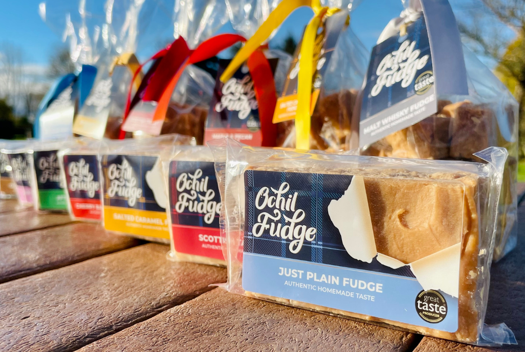 fudge bags lined up on a wooden bench